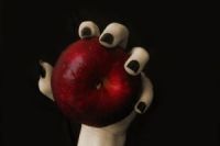 witchs-hand-on-apple-1193454-m